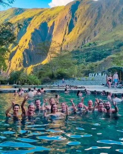 Relaxing at the Cocalmayo hot springs, a popular stop along the Salkantay Trek, offering soothing thermal waters surrounded by stunning natural scenery.