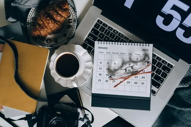 travel planning laptop calendar